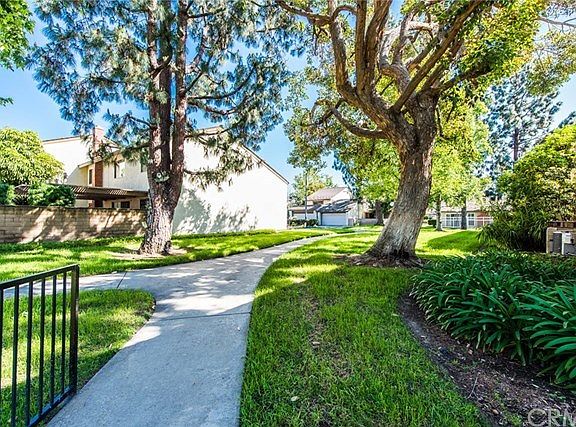 ANOTHER VIEW OF THE TREE LINED WALKING PATHS WITHIN THE COMMUNITY