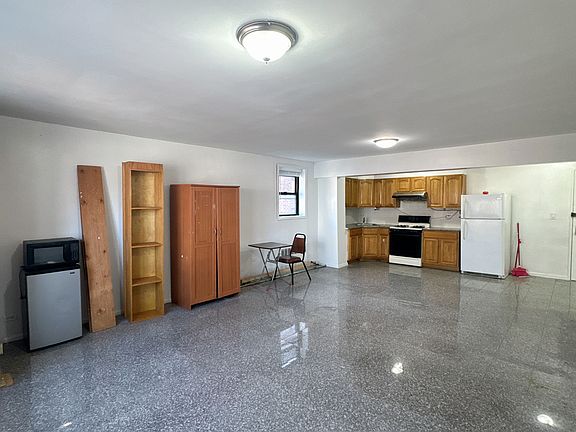 spacious living room with open kitchen