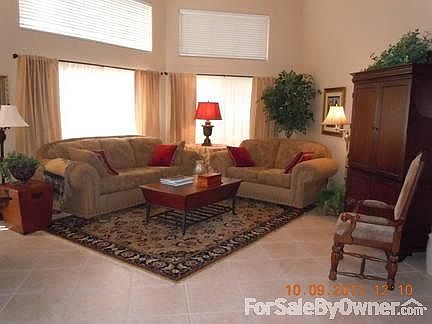 Living Room
						:
						Vaulted ceilings, Tile throughout, Updated light fixtures