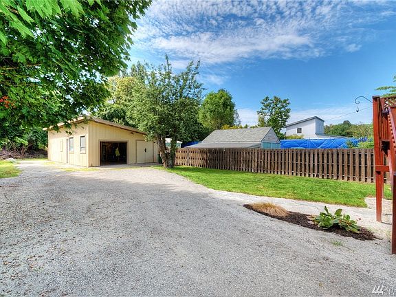 Detached shop, and huge amount of parking on the back side of the lot.