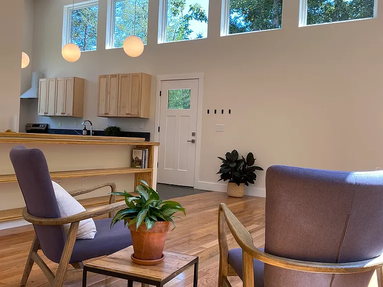15' high ceiling in living room and kitchen with lots of natural lighting.