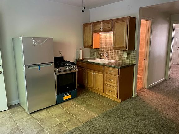 Newer Kitchen with Granite counter top and porcelain sink and pull out brushed Stainless design
New high end Stainless Steel appliances' and porcelain tile floor