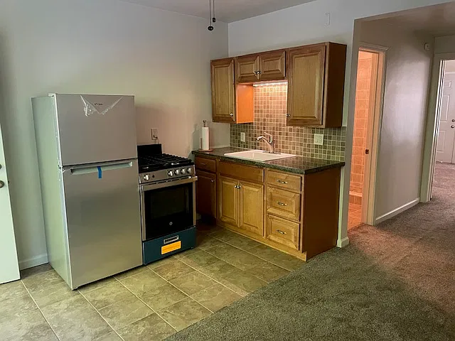 Newer Kitchen with Granite counter top and porcelain sink and pull out brushed Stainless design
New high end Stainless Steel appliances' and porcelain tile floor