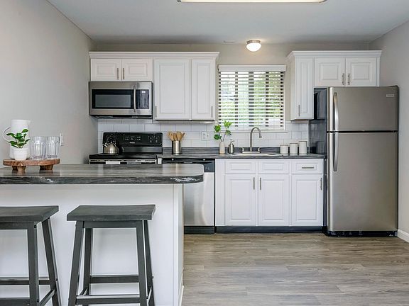 Elevate your daily life with modern kitchens featuring stainless steel appliances and an open-concept layout.
