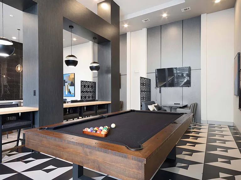 Unleash your competitive side with a game of pool in the lounge, perfect for fun and friendly matches.