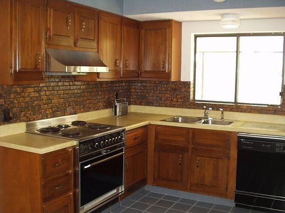 Kitchen with cherry cabinets, ceramic tile floor