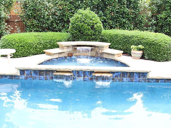 Three cascading waterfalls in the pool