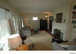 Living room w/ original hardwood floors