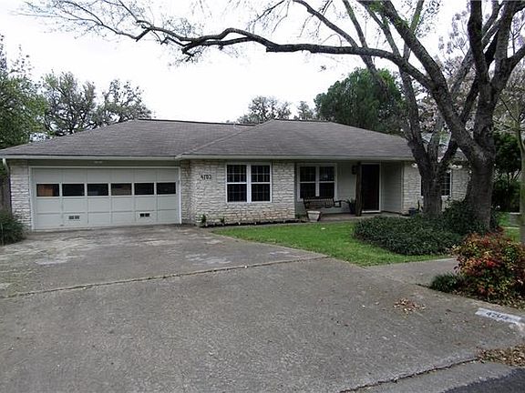 Two car garage has vents in door and opener was replaced in 2012. Windows on front replaced 2010.