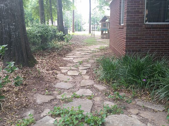 Rock path to back yard