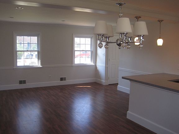 dining area looking into living area/ breakfast bar
