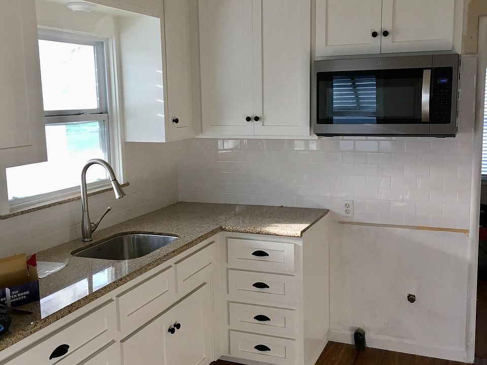 brand new cabinets and granite in this complete kitchen remo