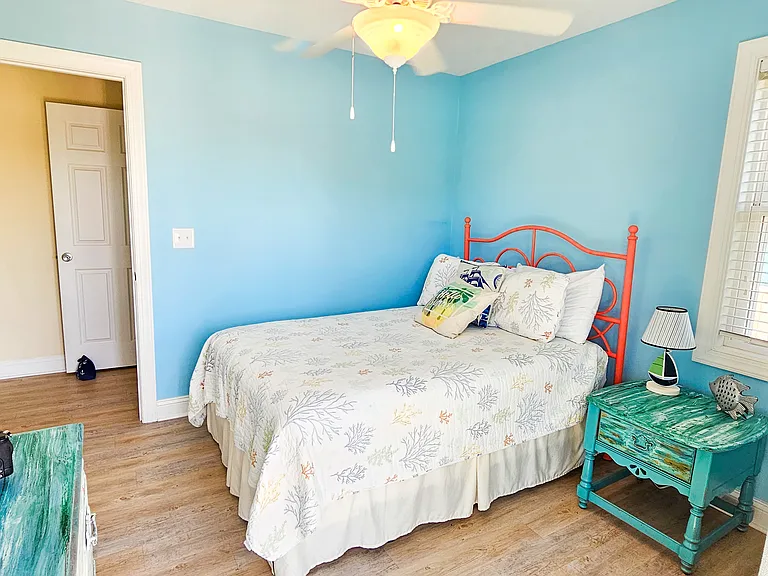 Queen Bedroom, downstairs. Balcony attached to room. Includes TV