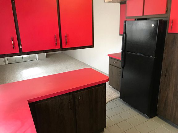 kitchen with plenty of cabinets and full size refrigerator