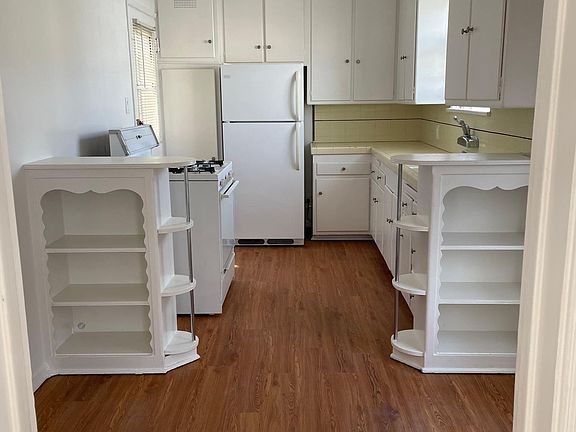 Kitchen with private back door and original tile