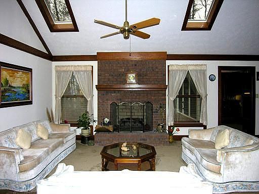 Enjoy this bright, large great room with masonry fireplac.