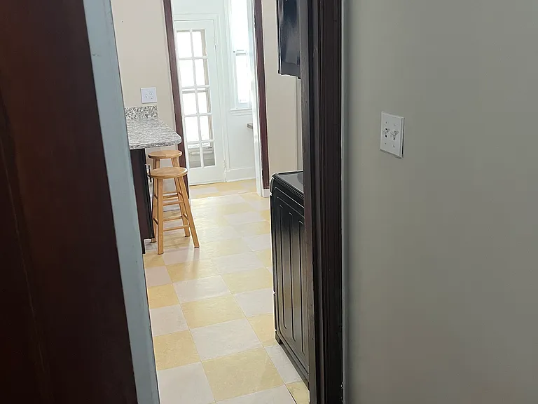 Hallway leads to kitchen, bedroom, bathroom, and closet.