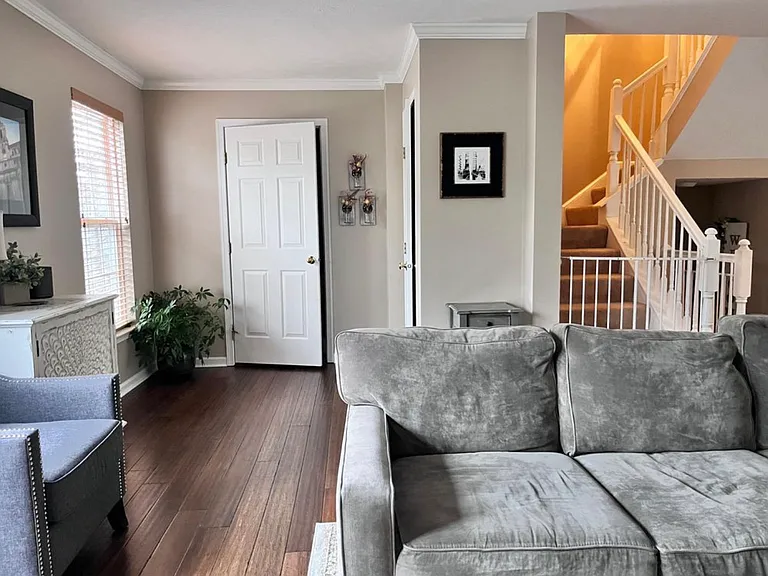 Living room with half bath and coat closet