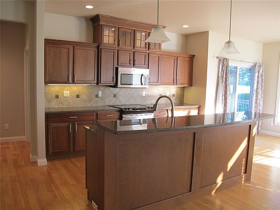 Kitchen - granite, cherry cabinets, island