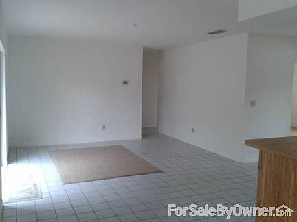 Large Tiled Family Room
						:
						Enjoy the ease of double sliding doors out to patio and extra large backyard.