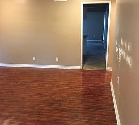 Living Room. View into kitchen and dining room