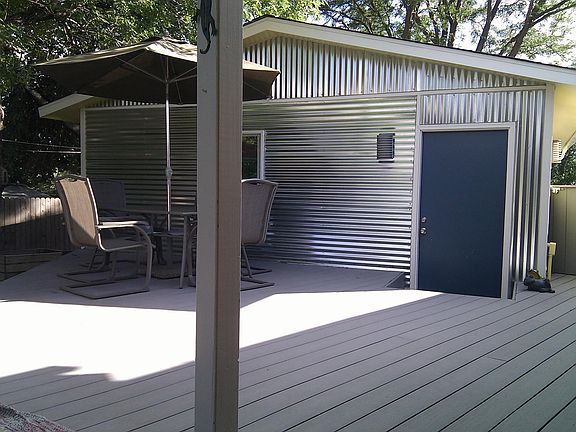 450 sf Deck shaded by a large Ash Tree. Great for outdoor entertaining or relaxation.
