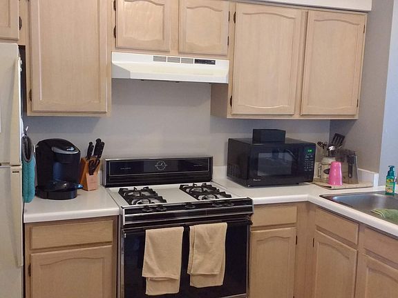 Kitchen showing refrigerator, stove, dishwasher.