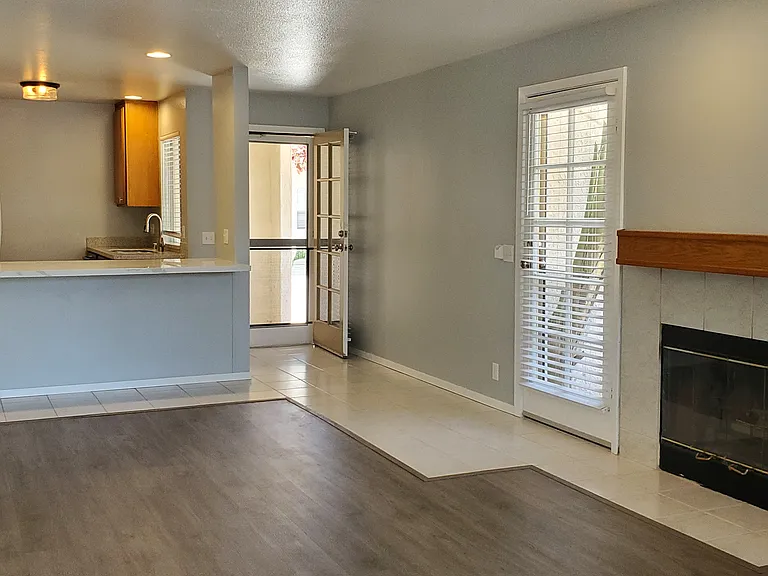 Gas burning fireplace, side door and back door
