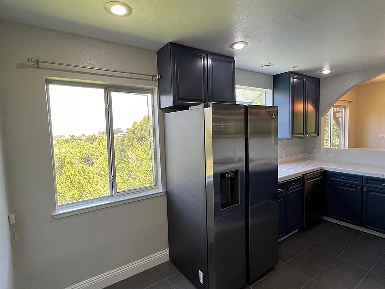 Kitchen with newer refigerator