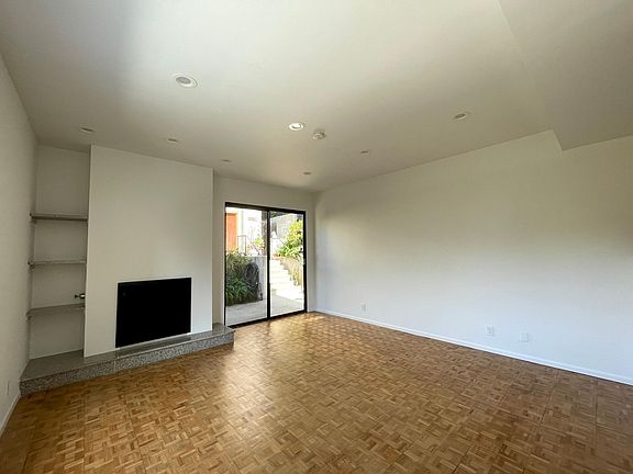 Spacious, walnut floor living room w high ceilings