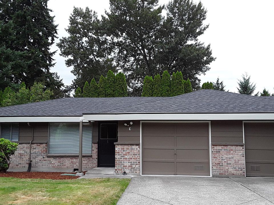 Front yard view; single car garage with additional driveway parking