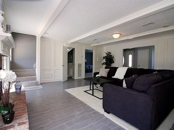 Ample space in the family room that has the hidden staircase and entry to the master bedroom.