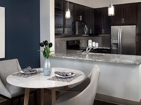 Gourmet kitchens feature granite or quartz finishes