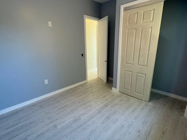Bedrooms each have minisplit and closet. Ceiling fan changes light colors. 10' ceilings.