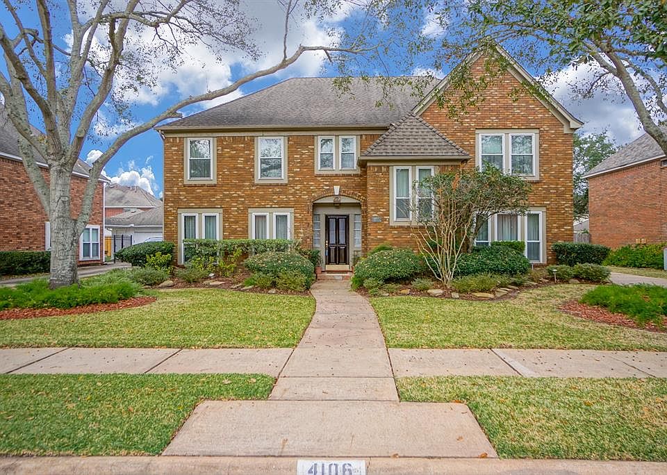 Wonderfully spacious home nestled under stately shade trees on a quiet dead-end street just a short walk away from beautiful Frost Lake.