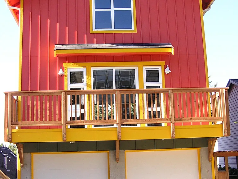 Entrance from alley. The one car garage on the right is included. Balcony on main level is included.
