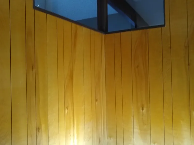 First bedroom has clerestory windows with a view to the skylight over the atrium.
