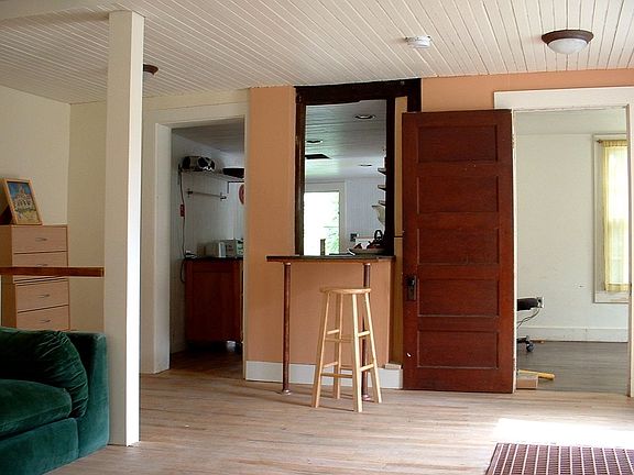 Livingroom, kitchen, & first floor bedroom.