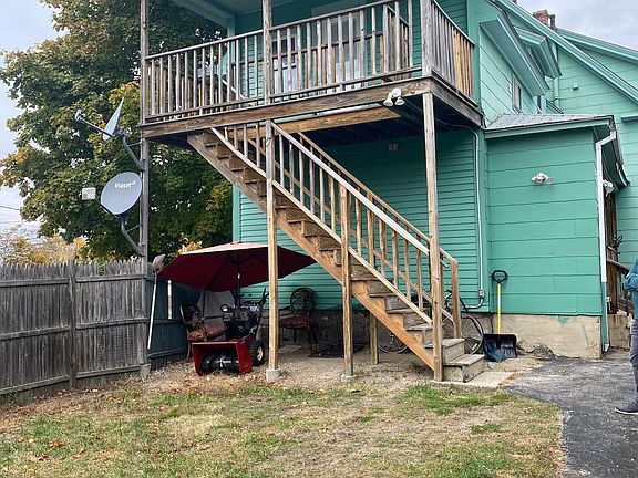 Private entrance to 2nd floor with porch overlooking back yard