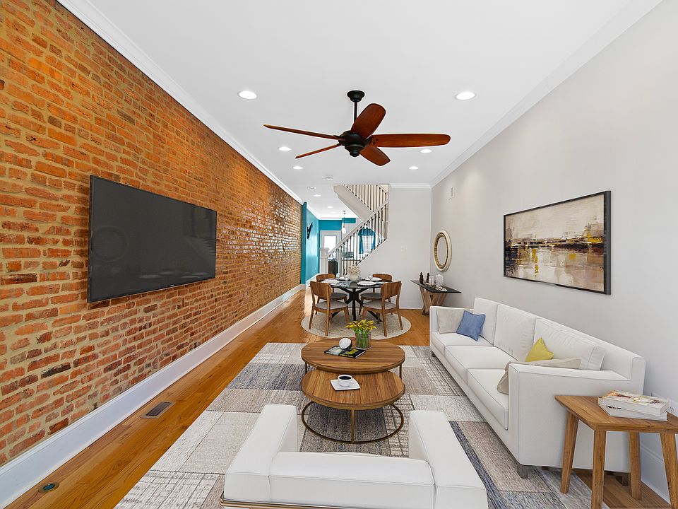 Large 28ft living room, with exposed brick