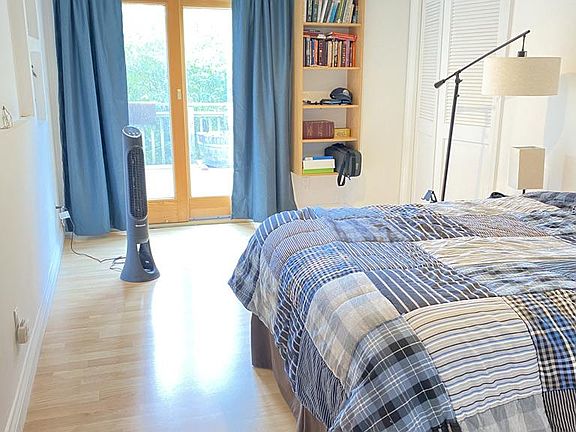 Bedroom with patio doors leading to deck