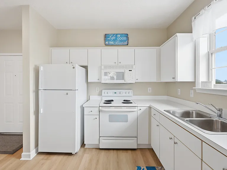 Spacious full kitchen perfect for preparing meals during your stay.
