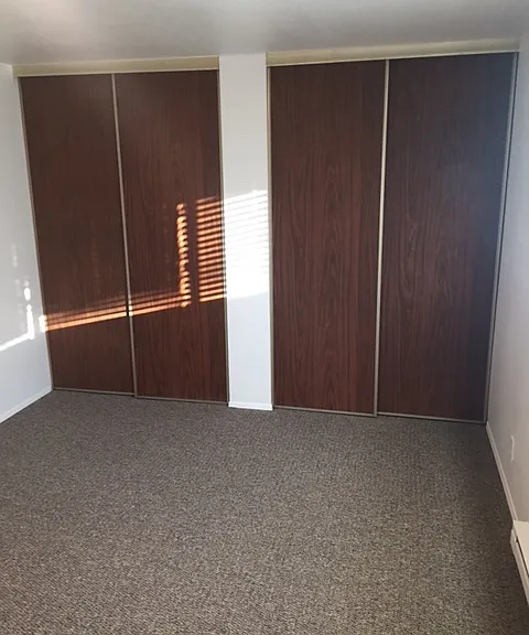 Very large Bedroom with 2 sets of closet (third set on another wall).