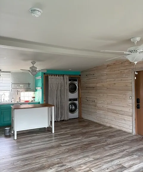 View into kitchen from living room. Macrame curtain can cover the washer/dryer as well as storage area next to it.