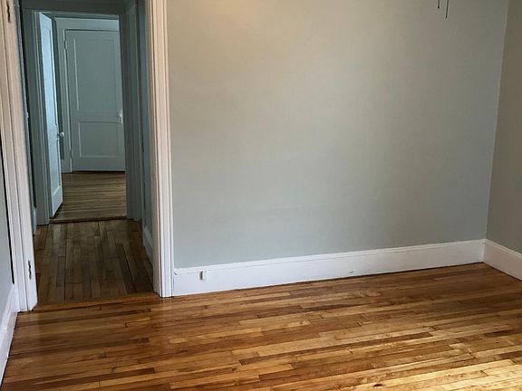 Living room, looking through hall to bedroom.