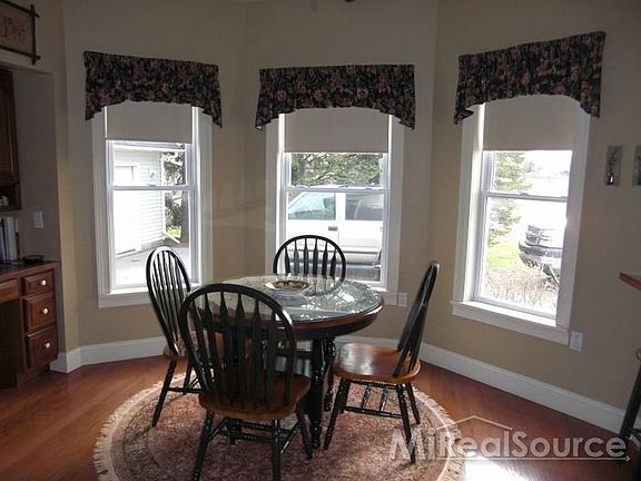 With hard wood floors and 1 of 3 bay windows.