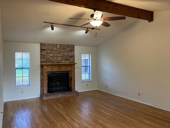 Spacious living room with wood burning fireplace
