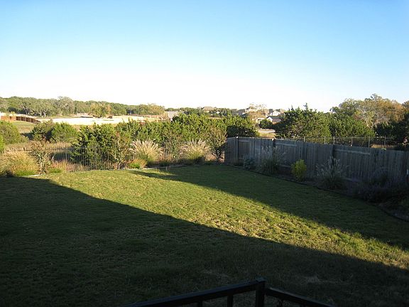 Fully fenced back yard on GREENBELT