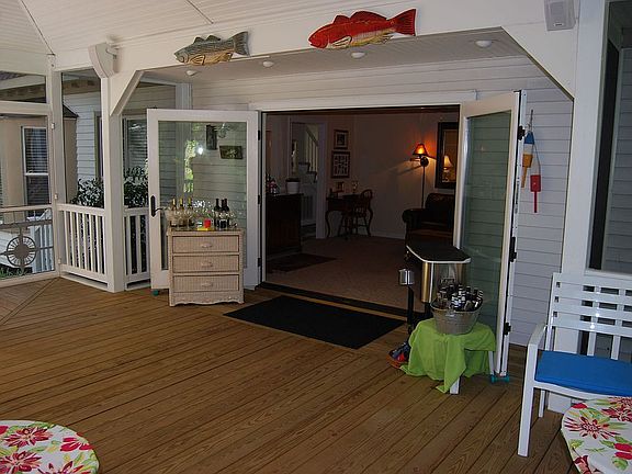 The party porch opens to the family room for ultimate entertaining