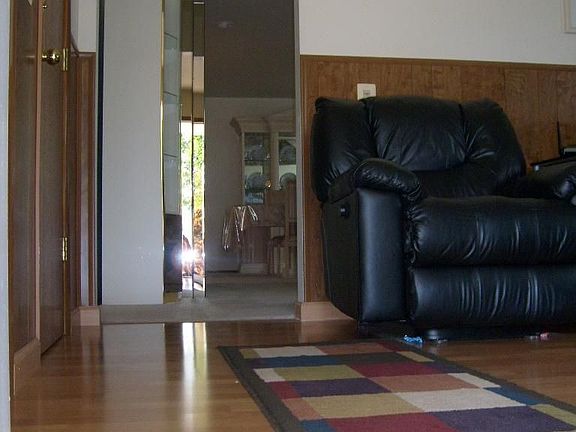 Pergo flooring into the spacious Den